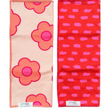 Two Crae hand towels with peach pink florals and red pink dash print.