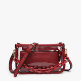 Clear crossbody bag with crimson trim, chain strap, and removable inner pouch