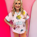 Pink V-neck top with nautical sequin designs and contrasting aqua trim.