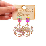 Rhinestone crab dangle earrings with gold details and oversized iridescent multicolor crystal studs.