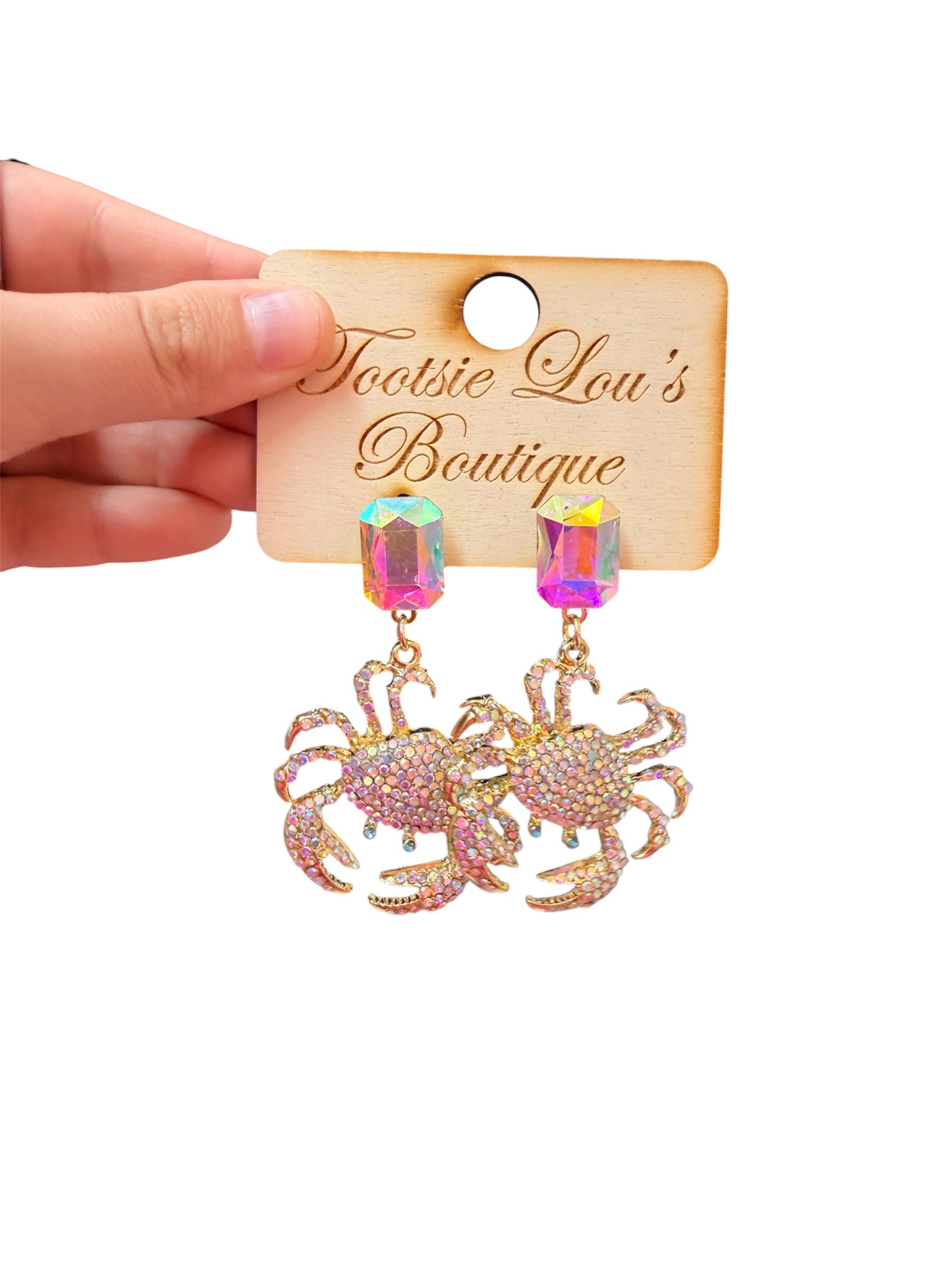 Rhinestone crab dangle earrings with gold details and oversized iridescent multicolor crystal studs.