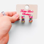 Iridescent crystal earrings with two faceted square stones in a double-drop design.