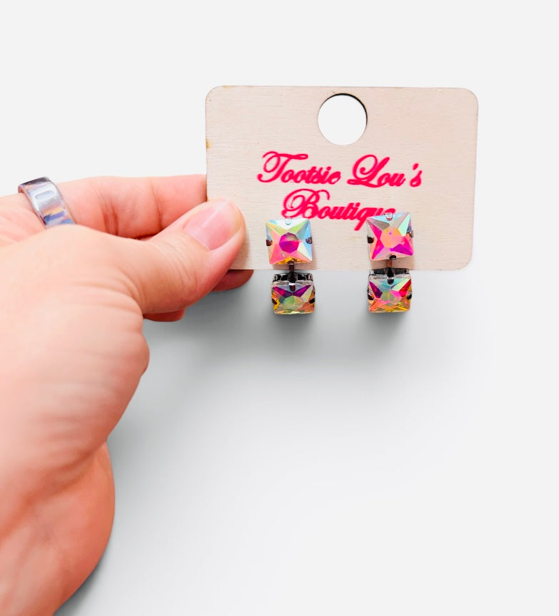 Iridescent crystal earrings with two faceted square stones in a double-drop design.