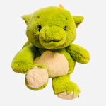 Green dragon Warmies plush with orange horns and soft weighted design.