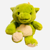 Green dragon Warmies plush with orange horns and soft weighted design.