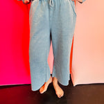 Light teal acid wash French terry sweatshirt with exposed seams and a hi-low hem.