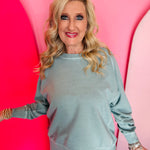 Ash blue French terry long sleeve pullover with contrast stitching and ribbed cuffs.