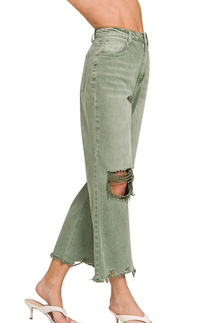 side view of Olive distressed knee jeans with raw hemline and high waist fit