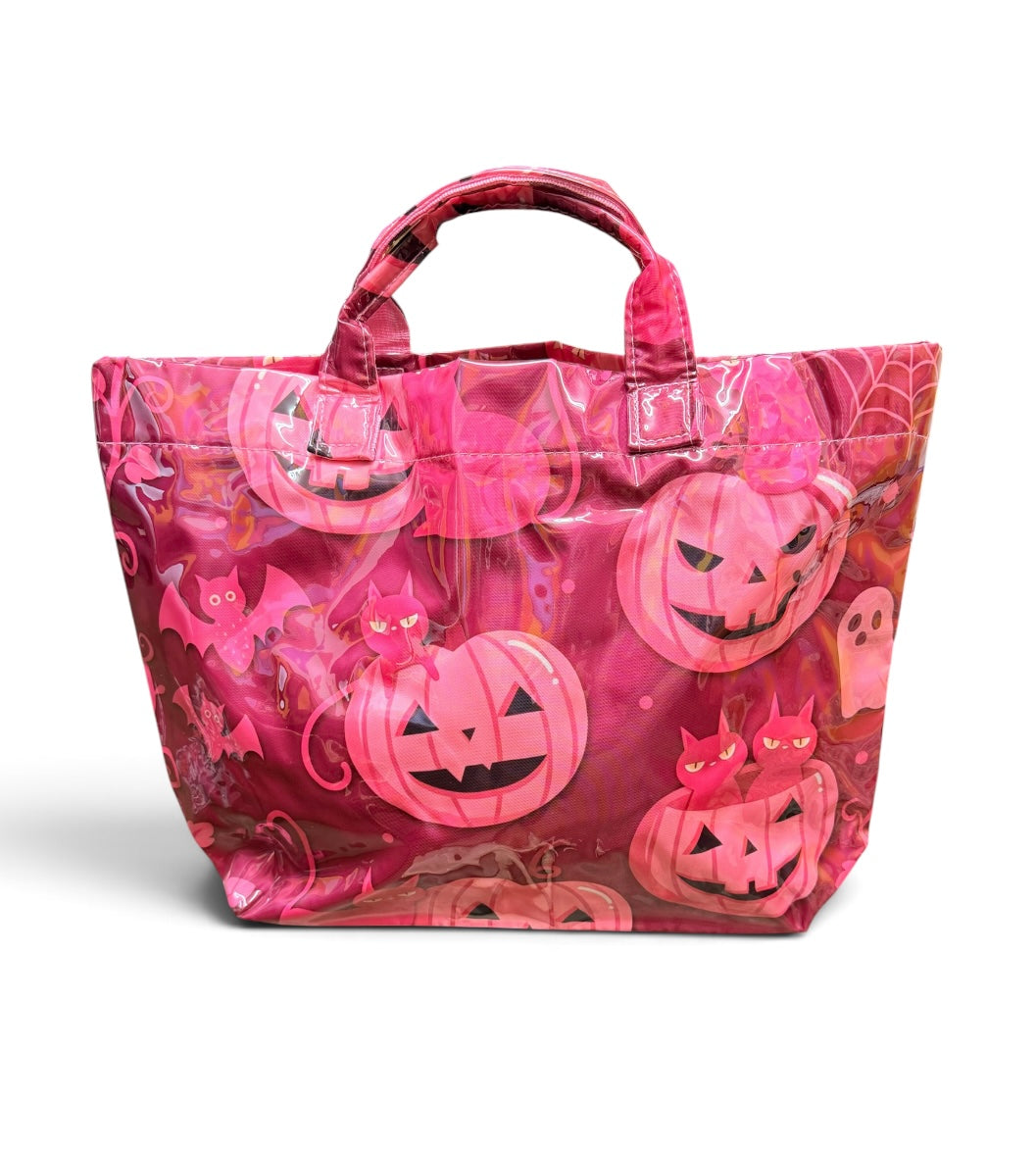 Dark pink Halloween tote with jack-o'-lanterns, black cats, bats, spiderwebs, and coral accents.