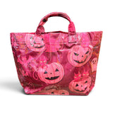 Dark pink Halloween tote with jack-o'-lanterns, black cats, bats, spiderwebs, and coral accents.