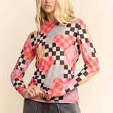 Sheer mesh top with red, pink, and black checkered pattern and oversized heart details.