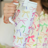 40oz tumbler with spring bow design, flip-straw lid, handle, and car cup holder compatibility.