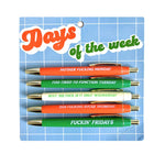 Set of pens with humorous phrases on a blue grid background