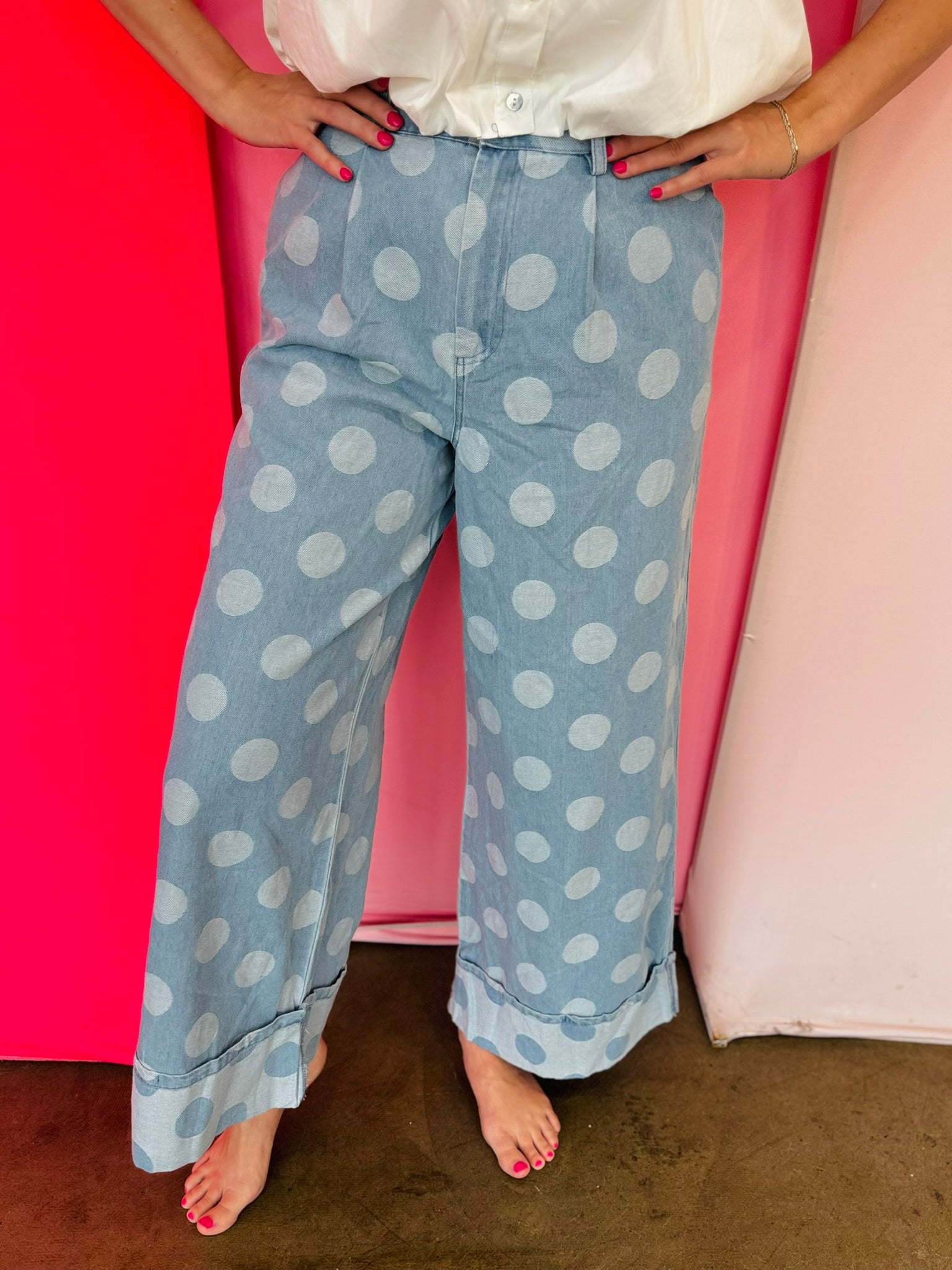 Chambray-inspired wide leg pants with oversized polka dot print and pockets.