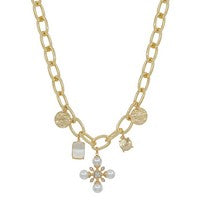 Dev Gold Necklace, 16–18 in chunky gold link chain with pearl cross, hammered coin, and rhinestone charms.