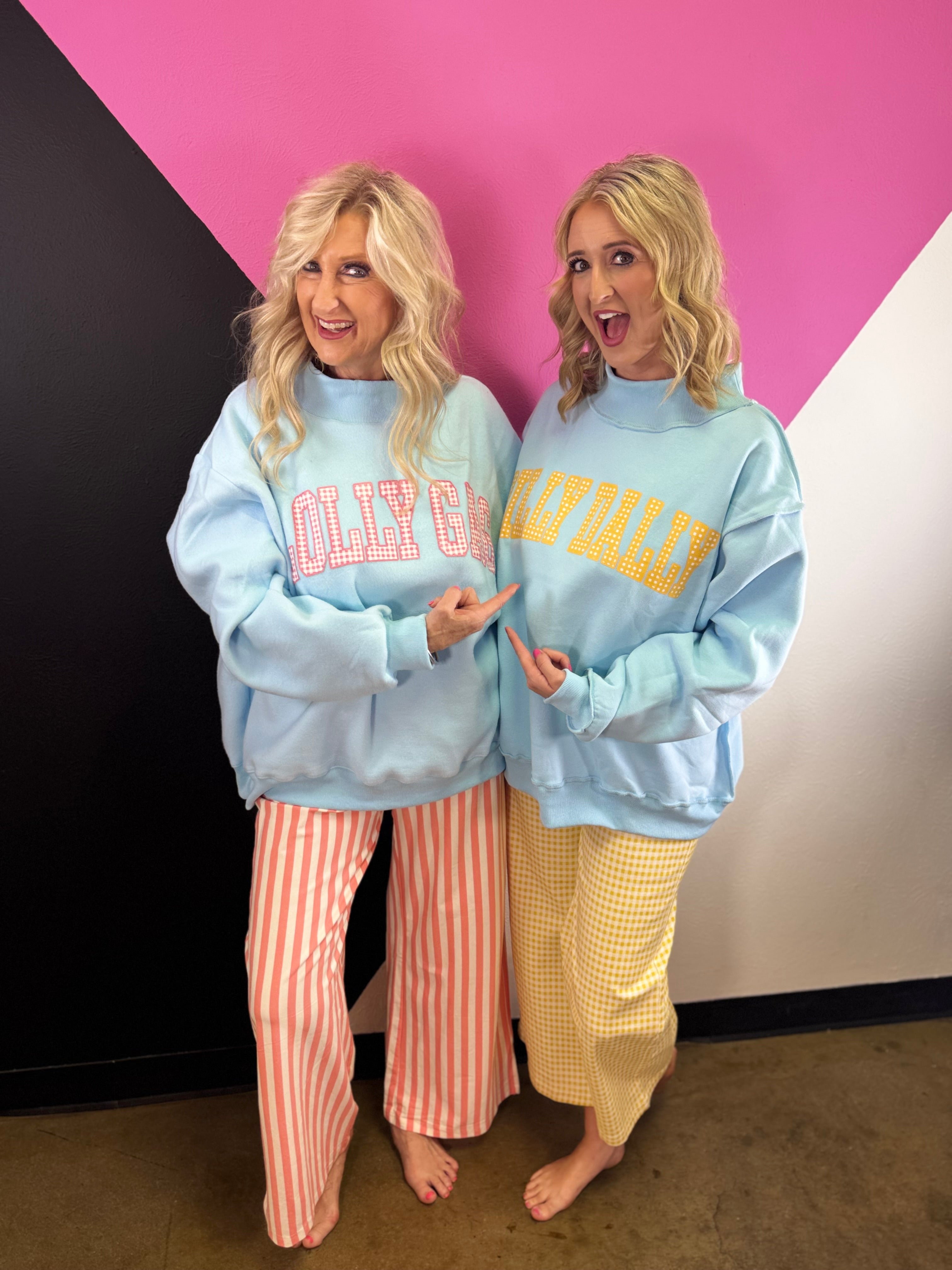 Blue reversible sweatshirt with yellow DILLY DALLY and pink LOLLY GAG lettering.
