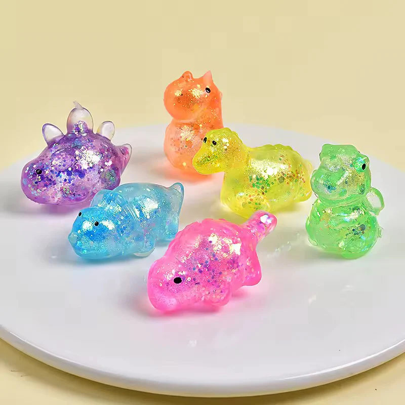 Colorful dinosaur squishy stress toy in assorted colors.