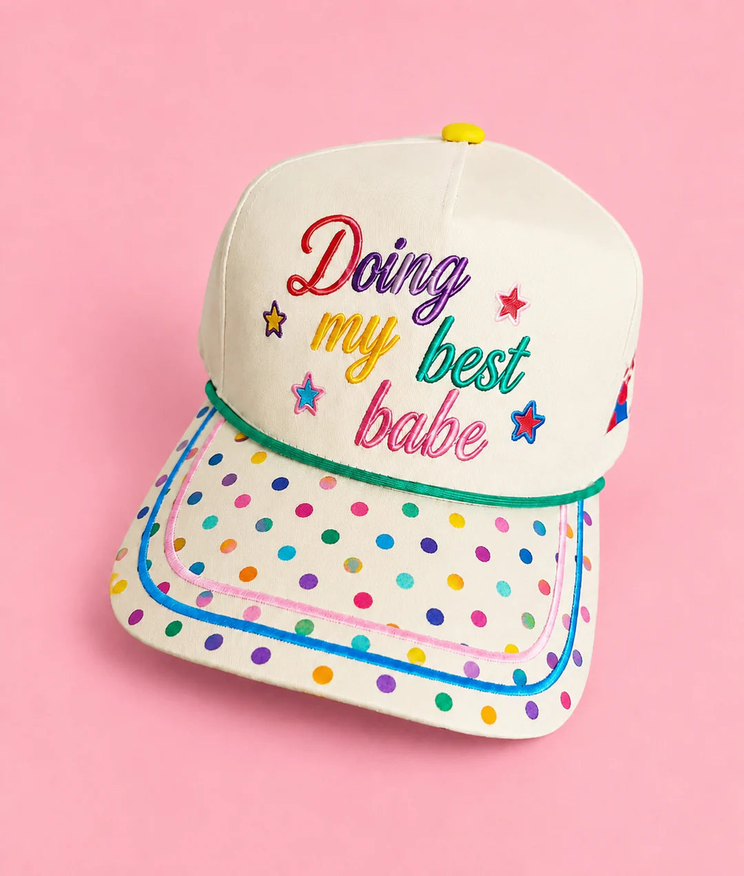 Cream hat with rainbow polka dot bill and colorful Doing My Best Babe embroidery.