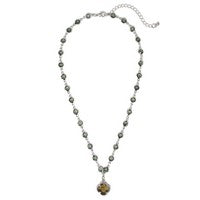 Gold-tone necklace with black diamond accents and black clover pendant, adjustable 16–18 inch length.