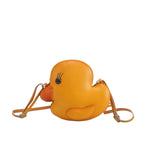 Leather duck crossbody handbag with adjustable strap.