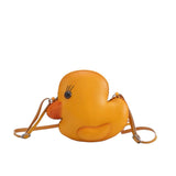 Leather duck crossbody handbag with adjustable strap.