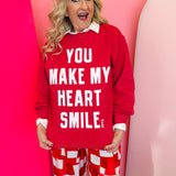 Heather red sweatshirt with bold white “You Make My Heart Smile” lettering and classic crew neckline.