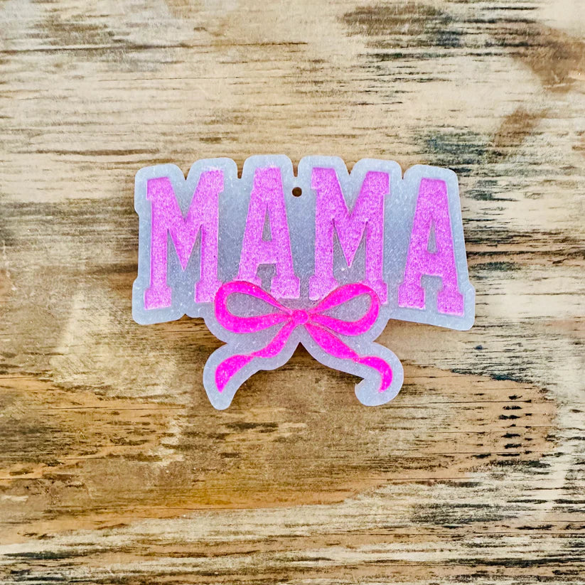 Hot pink car freshie with Mama graphics and a bow.