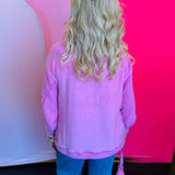 Back view of the sweater displaying the slightly longer hemline and relaxed drape for a comfortable, laid-back fit.