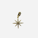 Gold-tone eight-point starburst scarf charm with crystal inlays and a center stone, finished with a gold clasp.