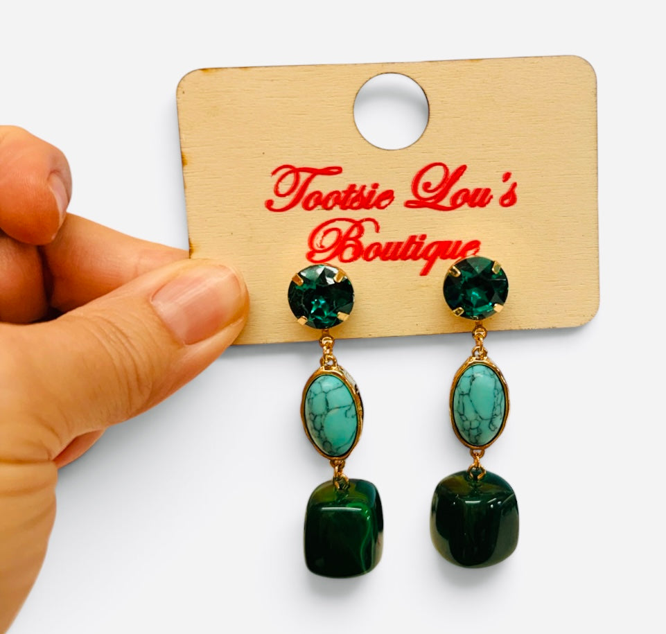Emerald green and turquoise gemstone drop earrings with glossy beads and gold-tone settings.