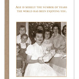 Vintage birthday card with heartfelt message and kraft envelope on recycled paper.