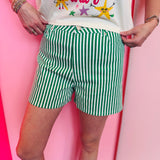Green and white striped shorts with button closure and pockets lightweight fabric
