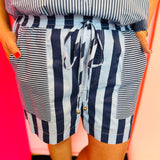 Navy striped shorts with elastic drawstring waist and mixed stripe panel detail