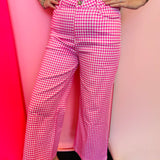 Pink gingham straight leg pants with pockets and button front closure.