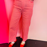 Red gingham straight leg pants with pockets and button front closure.