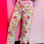 Watercolor floral wide leg pants with patch pockets and button front closure