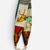 Equestrian scarf necklace with horse prints, pearl accent, and sparkling magnetic closure.
