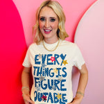 Ivory Everything Is Figureoutable tee with blue graphic and star accents.