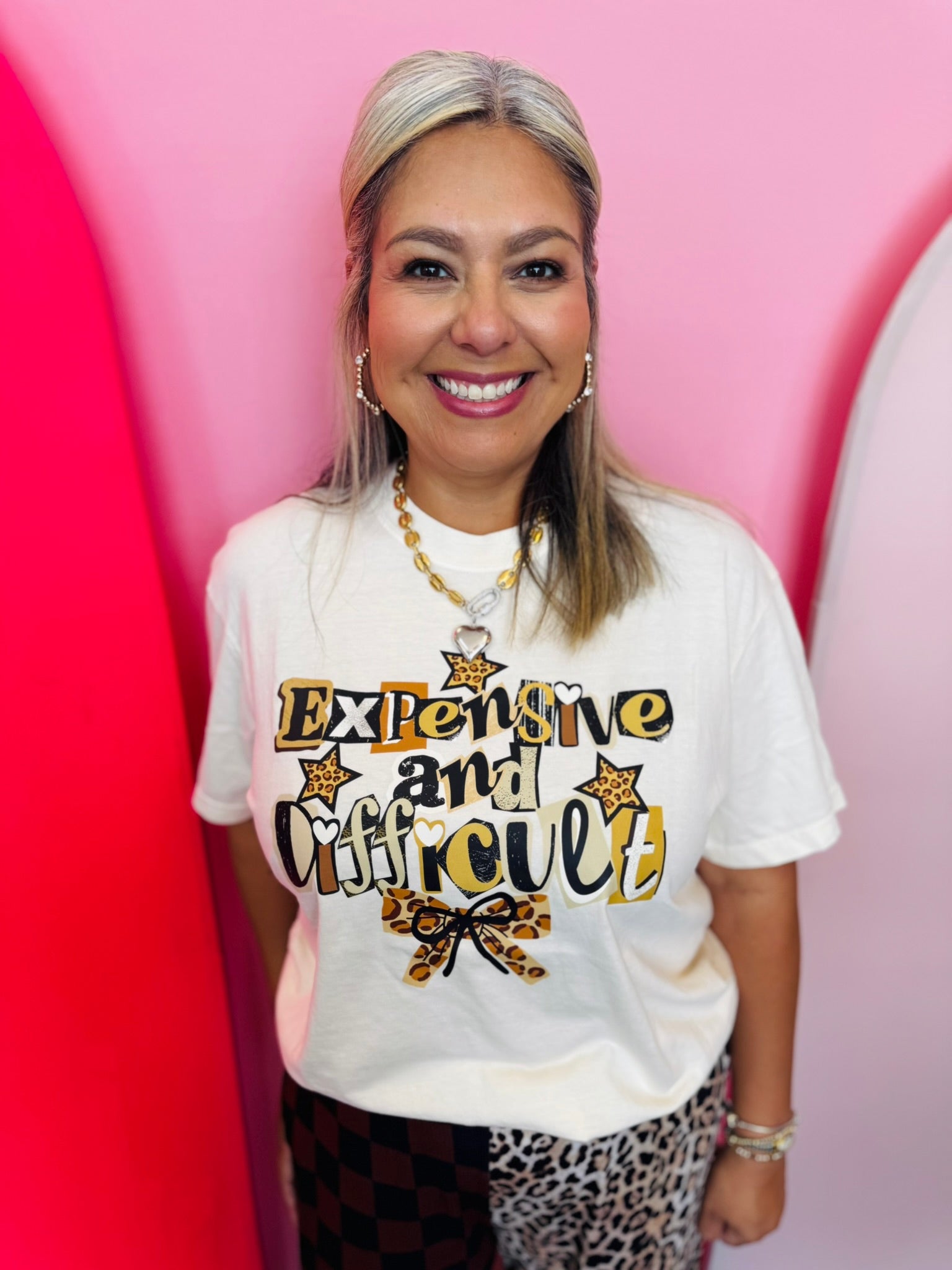 Cream Comfort Colors tee with Expensive and Difficult graphic, leopard stars, hearts, and bow