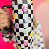 40 oz tumbler with checkered conversation hearts, flip-straw lid, handle, and car cup holder base.
