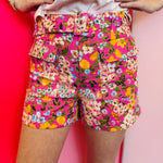 Floral high waisted shorts with pink orange yellow print and buckle detail