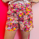 Floral high waisted shorts with pink orange yellow print and buckle detail