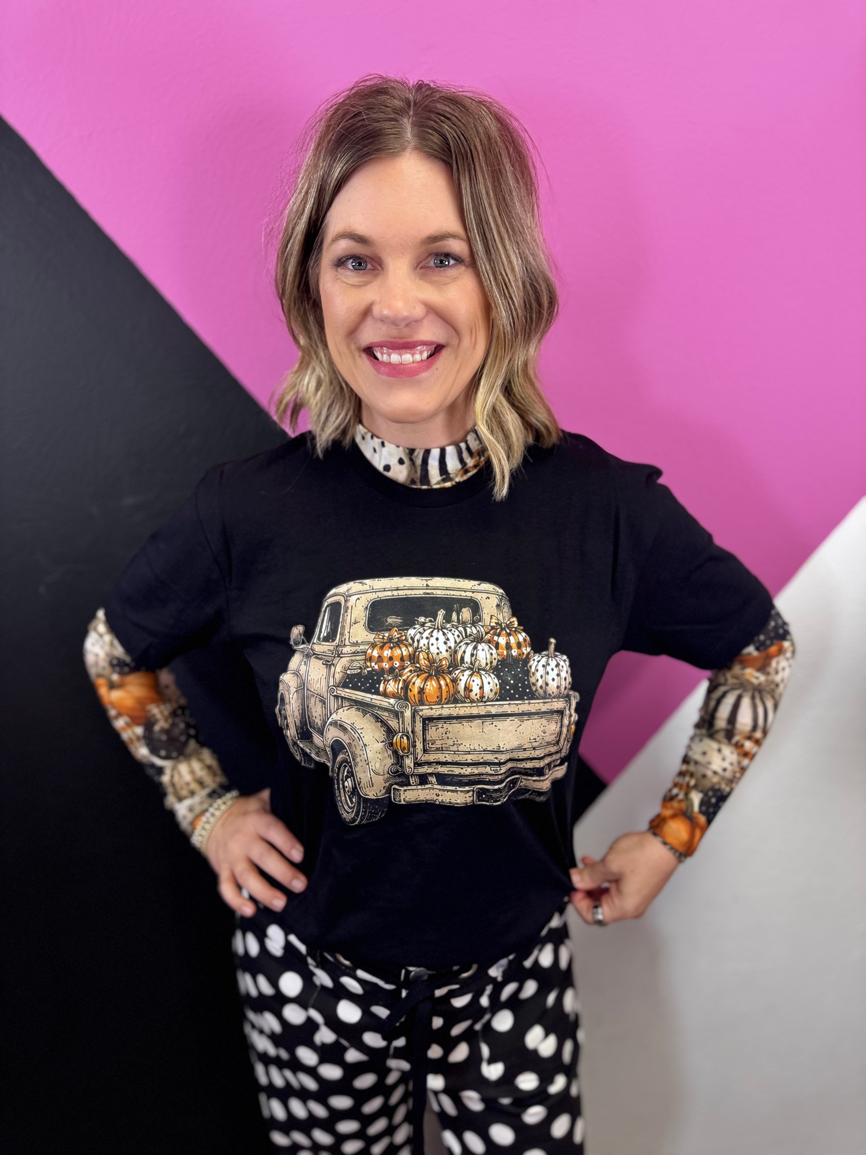 Black fall tee with vintage pickup truck filled with colorful patterned pumpkins.