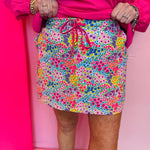Colorful floral skort with drawstring waist, built-in shorts, and vibrant spring print in bright colors