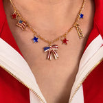 Jess Lea Gold charm necklace with red, white, blue stars, flags, and bow centerpiece on 16-inch chain.