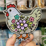 Floral Chicken freshie with chicken illustration and colorful flower accents.
