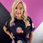Black game day top with colorful oversized sequin football helmet patches in mixed patterns.