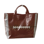 Brown football tote bag with spacious water-resistant PU-coated design.