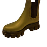 Matte olive ankle boots with stretchy side panels and chunky lug sole.