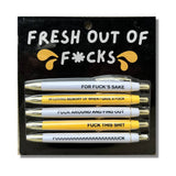 Set of white and yellow pens with funny profanity sayings for bold, unapologetic expression.